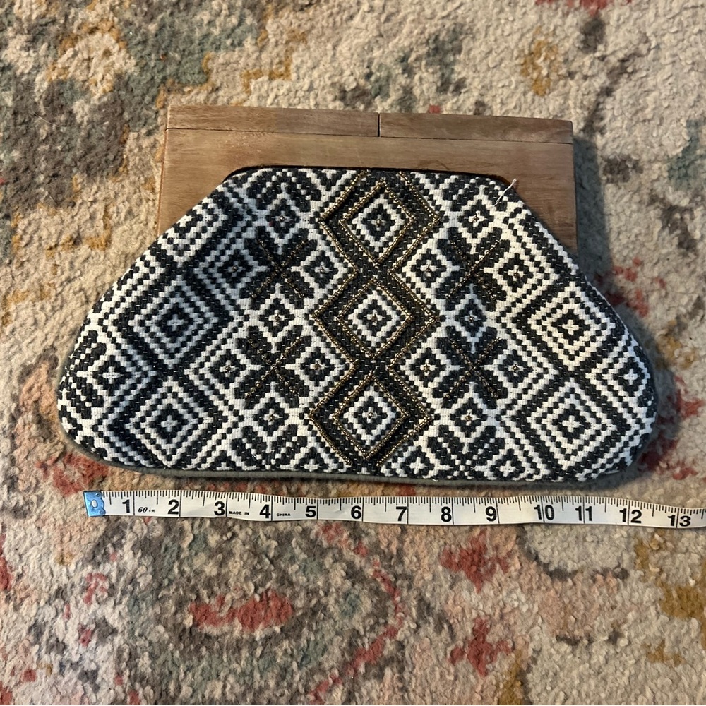Very cute handbag. Bought at a boutique and never used. Tag is still inside .